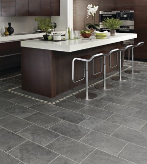 Kitchen with Cumbrian Stone tiles and border around the island